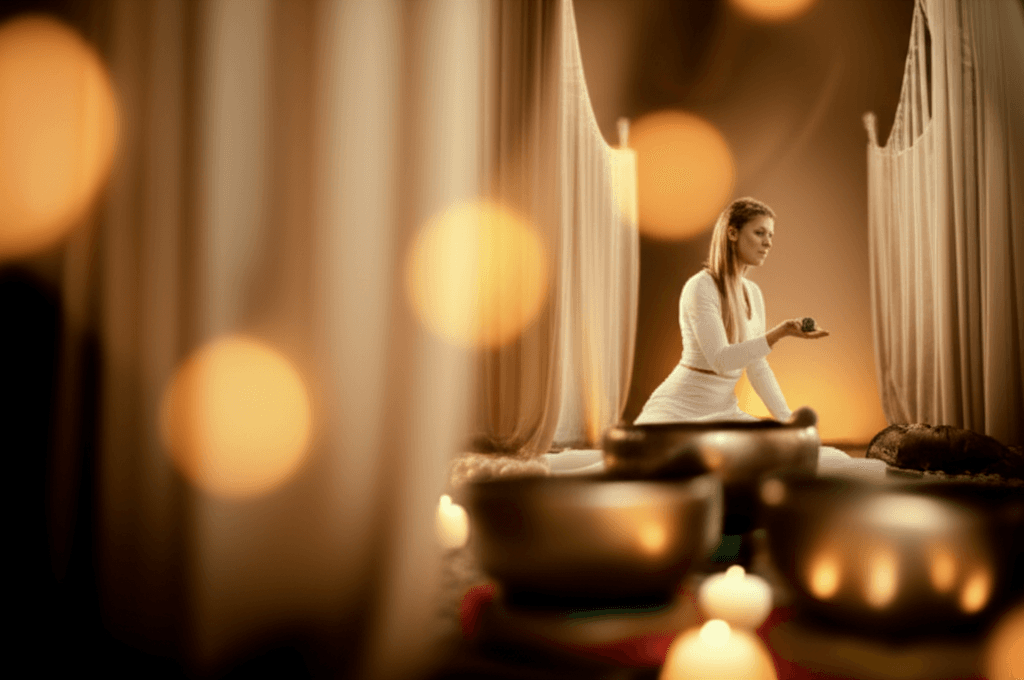 A pregnant woman relaxing during a sound wellness session at Soul Art, led by Larissa Steinbach, in Dubai.